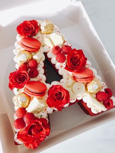 there is a cake in the box with roses on it