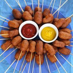 two dipping sauces in small white bowls on skewers with toothpicks