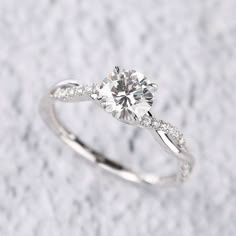 a white gold engagement ring with diamond accents