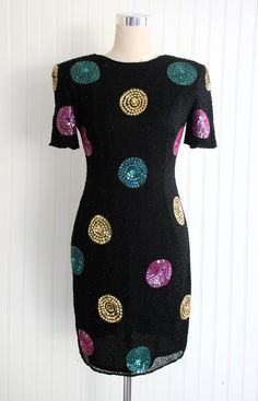 "This fun starts here!  This is a fully beaded cocktail dress with sequin polka-dots.   It is in very good to excellent condittion.  Rarely worn.  Marked size 8 36\" bust 30\" waist 38\" to a tight 40\" hip 36\" shoulder to hem  Purveyor's Note: We have searched far and wide, wrestled bears, braved the cold, traversed mountain ranges, fought pirates, swam with sharks and eaten at many a questionable road side taco stand to provide our customers with one of a kind vintage pieces.  Know that whichever piece you choose to make your own has its own story and has traveled through time to get to you.  Though we strive to provide the absolute best, \"pristine\" vintage pieces are rare birds, if not altogether non-existent.  That being said, please understand that part of buying and wearing vintag Taco Stand, Party Starters, 90s Party, Mountain Ranges, Beaded Cocktail Dress, Rare Birds, Vintage Pieces, Sharks, Dress Clothes For Women