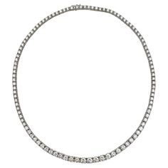 Riviera-style diamond line necklace in 18k white gold, featuring 105 natural fine near-colorless round brilliant-cut natural diamonds weighing approximately 9.33 total carats (G-H color, VS1-VS2 clarity). Each diamond ranging from 0.12 carats to 0.45 carats. This elegantly crafted necklace measures 16" in length with individual open-back links for a comfortable fit. Hidden fold-under clasp with safety latch at back. Marked '1328' and '750 18k' on clasp sections. Diamond And Sapphire Necklace, Riviera Necklace, Riviera Style, White Diamond Necklace, Diamond Tennis Necklace, Lace Necklace, Colorless Diamond, Modern Necklaces, European Cut Diamonds