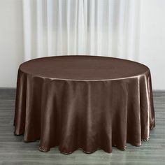 a round table with a brown cloth on it