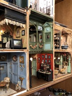 a doll house with furniture and accessories in it's display case on the wall