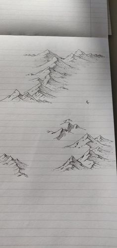 a pencil drawing of mountains on lined paper