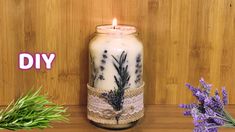 a jar with some lavender flowers and a candle