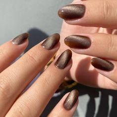 Gorgeous It girl nail inspo | Jelly cat eye velvet nails | 2025 hottest nail manicure trends #cateyenails #manicureinspo Brown Cat Eyes Nail, Bronze Cateye Nails, November Nails Cat Eye, Brown Tiger Eye Nails, Fall Nails Cateye, Taupe Cat Eye Nails, Brown Cateye Nails Design, Tigers Eye Nails Polish, Olive Cat Eye Nails