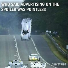 two race cars racing down a road with the caption who said advertising on the spoiler was polite