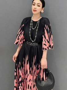 This elegant black pleated midi dress epitomizes casual chic, ideal for daily outings, gatherings, weddings, parties, or office looks. It features sophisticated pink markings that elevate its charm and style. Key Features: Pleated design for timeless elegance. Versatile for a range of occasions. Sophisticated pink markings enhance the dress's appeal. Comfortable and stylish silhouette. Why You'll Love It: Effortless elegance in every wear. Perfect for various events and gatherings. Adds sophisti Pink A-line Pleated Party Dress, A-line Midi Dress With Accordion Pleats For Party, Elegant Black A-line Pleated Dress, Pink A-line Midi Dress With Pleated Waist, Pink Pleated A-line Maxi Dress, Feminine Pleated Midi Dress For Party, Formal Black Pleated Dress With Pleated Waist, Formal Black Pleated Dress, Elegant Black Pleated Dress