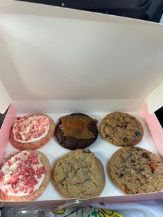 a box filled with lots of different types of cookies