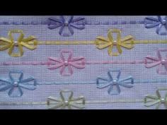 a close up view of some ribbons on a piece of cloth