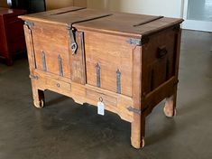 an old wooden cabinet sitting on top of a floor