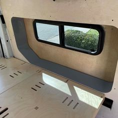 the inside of a camper with its windows open