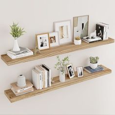 two wooden shelves with books and pictures on them next to a wall mounted planter