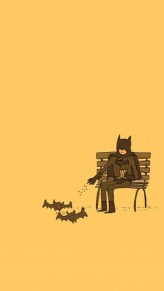 a batman sitting on top of a bench next to bats