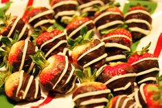 chocolate covered strawberries are arranged on a plate