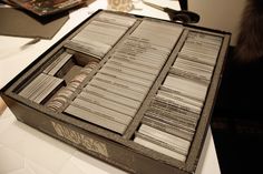 an open box with several cards in it on a table