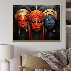 three african women wearing headdresses in front of a painting on the wall