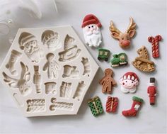 christmas cookie molds and decorations on a table