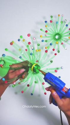 a person is holding a blower and spraying confetti on the top of it