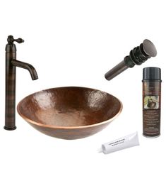 a copper bowl sink with faucet and soap dispenser next to it