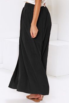 Black Buttoned Maxi Skirt Black Lined Relaxed Skirt Bottoms, Black High Waist Maxi Skirt, Black Full-length Flowy Skirt, Black Flared Skirt Bottoms With Elastic Waistband, Black Elastic Waistband Midi Skirt, Black Flared Skirt With Elastic Waistband, Relaxed Black Maxi Skirt, Beach Pleated Skirt Bottoms, Black Relaxed Maxi Skirt