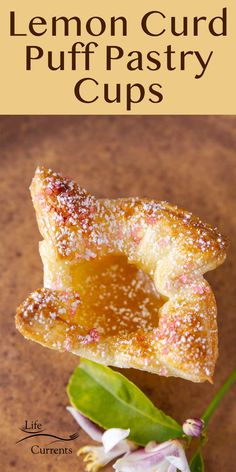 lemon curd puff pastry cups on a table with flowers and text overlay that reads, lemon curd puff pastry cups