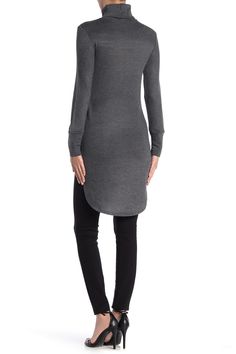 A classic turtleneck offers a refined, elegant style into a tunic sweater with a dramatic high/low hemline. Turtleneck. Long sleeves. Knit construction. High/low hem. Approx. 30" shortest length, 38.5" longest length (size S). ImportedAvailable in:. Solid colorway (Black). Geometric print (Charcoal Colorful Geo). American flag print (Heather Grey USA Verticals). Elephant print (Charcoal Elephant Up). Lion print (Charcoal Lion Mane). Colorblock print (Ivory Blocks & Peacock Print)This item ca Back To School Outfits Black, Classic Turtleneck, High Low Tunic, Peacock Print, Back To School Outfits, Black Boys, Tunic Length, Tunic Sweater, Wedding Wear