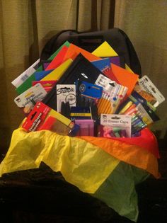 a bag full of school supplies sitting on top of a table