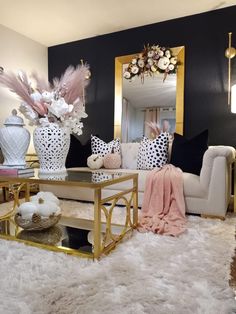 a living room filled with lots of furniture and flowers on top of a coffee table