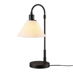 a lamp that is on top of a white table cloth and has a black base