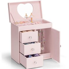 a pink jewelry box with three drawers and a heart shaped mirror on the top shelf