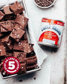 a can of eagle brand chocolate next to a container of ice cream and some brownies