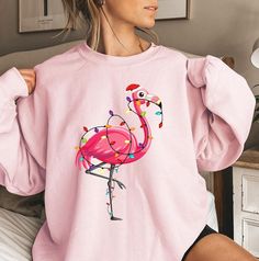 Flamingo Christmas Sweatshirt, Flamingo Christmas Shirt For Women, Flamingo Merry Christmas Sweatshirt, Flamingo Lover, Funny Flamingo Shirt ⭐️ Welcome to FlyaWay Trend Store ⭐️ Our products are BELLA+CANVAS and for Sweatshirts GILDAN quality ✨ FREE SHIPPING is for orders 35 usd and over. Enjoy 30 % OFF SALE! Please contact me for bulk (+10) orders. If you have any problems or questions, please contact me and I will be here to help. NO RETURNS OR EXCHANGES ON SHIRTS/CLOTHING ITEMS. FIT AND SIZIN Flamingo Fashion, Funny Flamingo, Flamingo Shirt, Pop Up Window, Flamingo Christmas, Christmas Sweatshirts, Shirt Outfit, Christmas Shirts, Flamingo