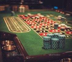 a casino table with poker chips and cups on it - stock photo - photoshop