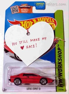 a red hot wheels car with a heart on it