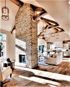 a living room filled with furniture and a fire place