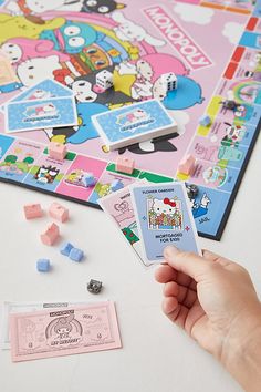 someone is playing the hello kitty board game