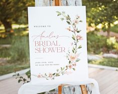 an easel with a sign on it that says, welcome to the bridal shower