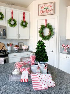 a kitchen counter with christmas decorations on it