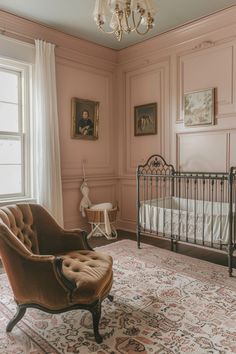 a baby's room with a crib, rocking chair and chandelier