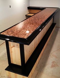 a large wooden counter sitting in the middle of a room