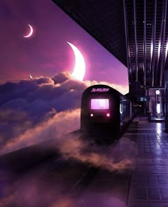 a train traveling down tracks next to a tall building with a crescent moon in the sky