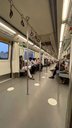 people are sitting on the subway train