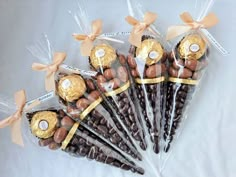 chocolate candies wrapped in cellophane and tied with gold ribbon