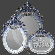 three round mirrors with ornate designs on the sides and an oval mirror in the middle