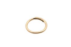 an open gold ring on a white background