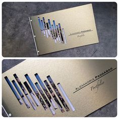 two business cards with different types of pens on them, one is gold and the other is silver