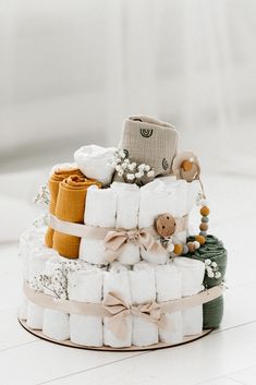 a stack of diapers sitting on top of a white floor next to each other