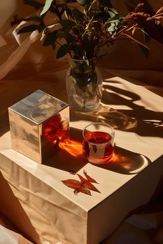 A glass of tea sitting on a wooden table in golden hour light. Autumn Inspired, Well Lights