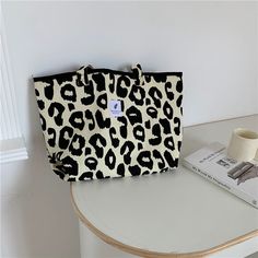 Style: Western, sweet Material: Canvas Weight: Shoulder bag 1134g Small bucket bag 147g Cosmetic bag 118g Size: Shoulder bag 32CM*52CM Small bucket bag 22CM*28CM Cosmetic bag 18CM*26CM Pattern: Leopard print, animal print The design of this bag is a leopard pattern, which is very foreign and very unique! The cute mini bucket bag is playful and cute, especially youthful; the cosmetic bag can be filled with your own cosmetics to prevent it from being lost. These three bags can be changed at will w Canvas Bucket Satchel For Shopping, Casual Large Satchel Bag, Casual Large Capacity Pouch Bag, Trendy Beige Bucket Bag For School, Trendy Large Capacity Pouch Canvas Bag, Trendy Large Capacity Canvas Pouch Bag, Trendy Canvas Bucket Bag Tote, Trendy Canvas Bucket Bag Shaped As Tote, Trendy Tote Box Bag For School